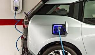 Electrician installing car charger